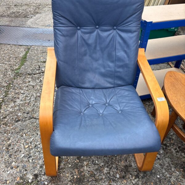 Vintage blue leather armchair with wooden cantilever base.