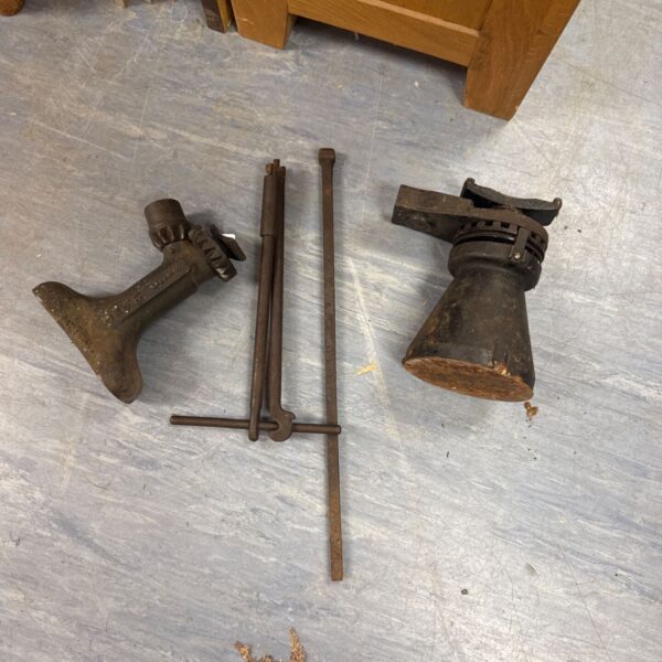 Vintage pair of ratchet bottle jacks for automotive repair.