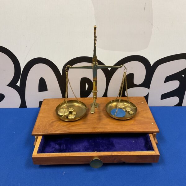 Vintage brass balance scales with weights in wooden box.