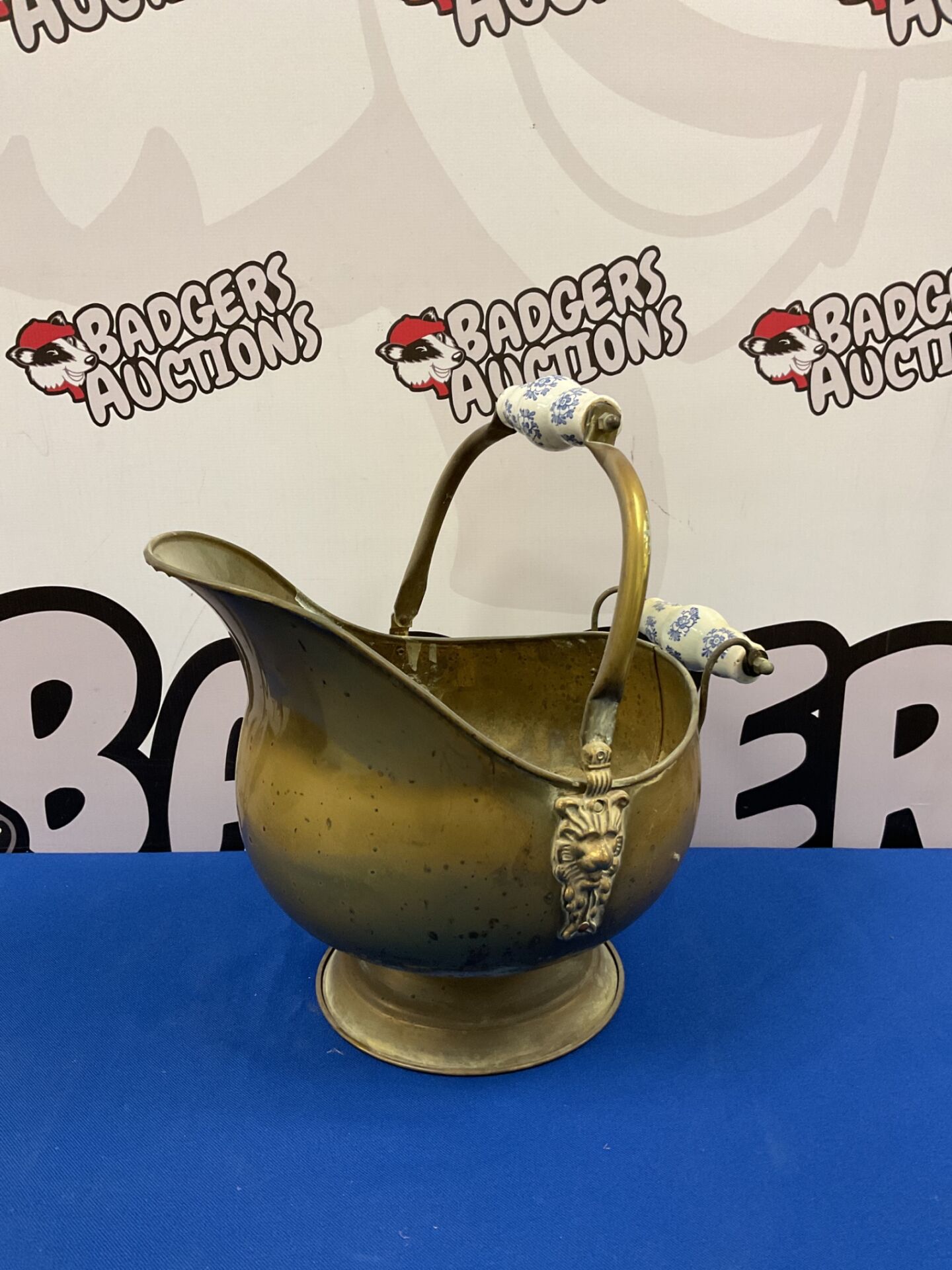 027 Vintage brass helmet coal scuttle with blue & white ceramic handles