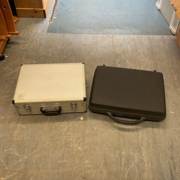 Silver vintage briefcase with handle and clasp.