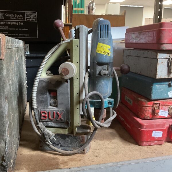Vintage BUX magnetic drill press, industrial tool for metalworking.