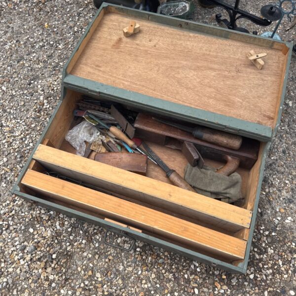 Vintage carpenter's toolbox filled with antique woodworking tools.