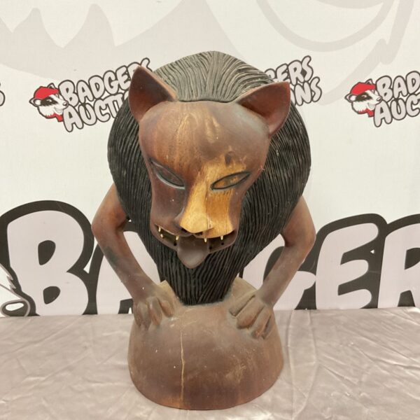 Vintage carved wooden African lion sculpture, detailed carving.