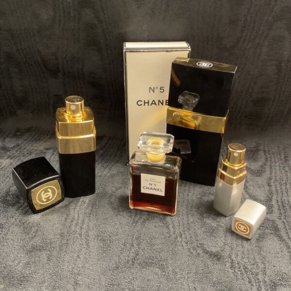 Vintage Chanel No 5 perfume bottles and spray, collectible fragrance.