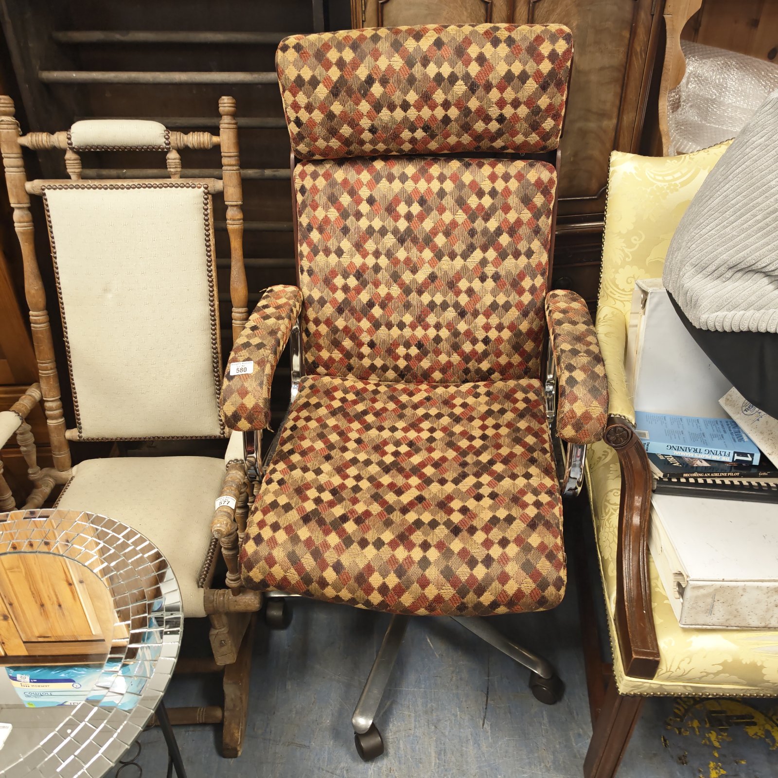 Vintage chrome office swivel chair with patterned fabric.