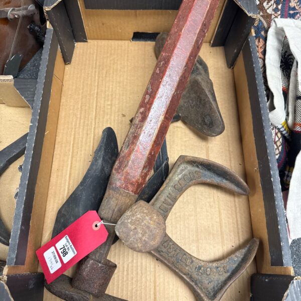 Antique cobblers hammer with wooden handle, vintage shoe repair tool.