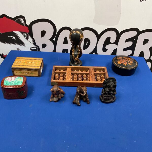 Vintage collectible set with abacus and carved animal figures.