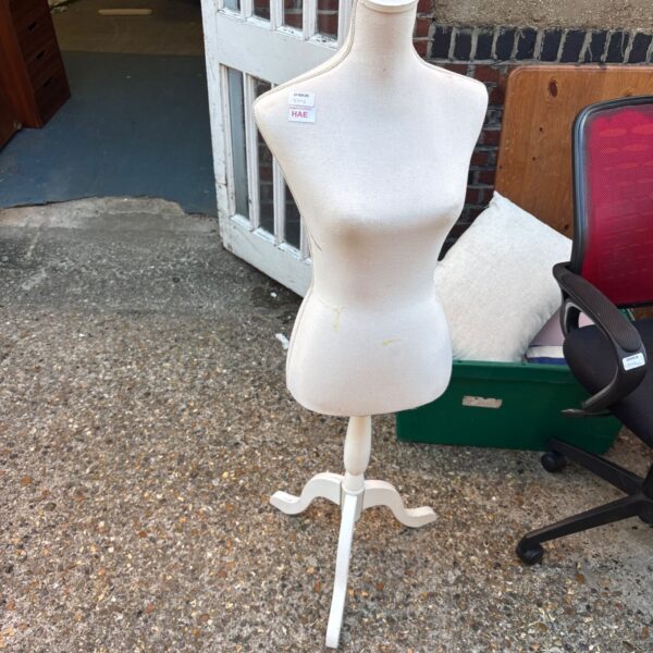 Vintage female dressmaker’s dummy with wooden tripod base.