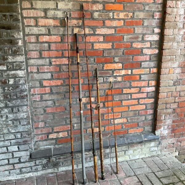 Bundle of vintage fishing rods including Foster Bros examples.