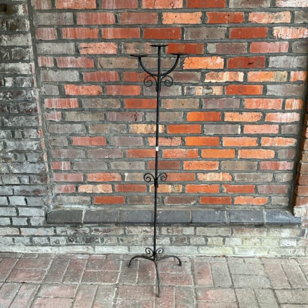 Vintage floor standing candlestick with tripod base and three candle holders.