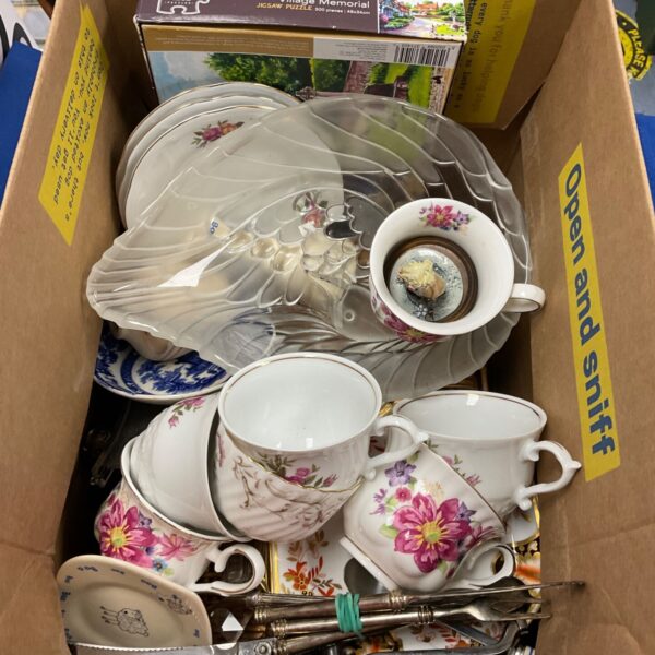Vintage floral tea set with porcelain cups and saucers.