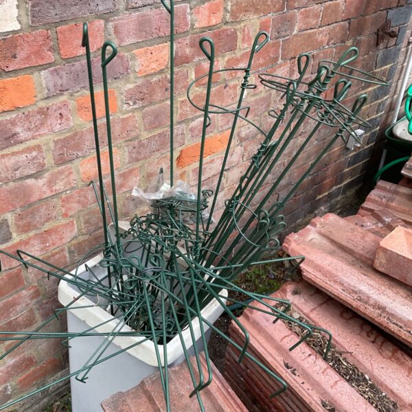 Set of vintage metal flower training frames for garden plants.