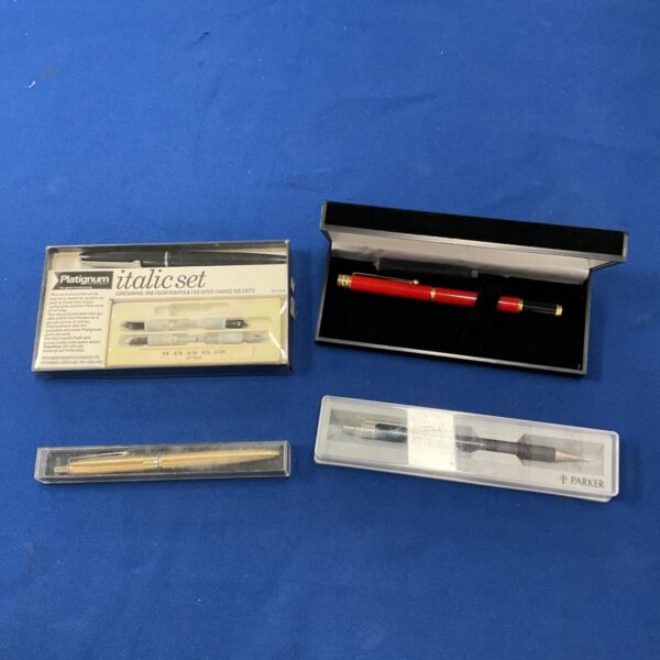 Vintage fountain pen set including Parker and Platignum pens.