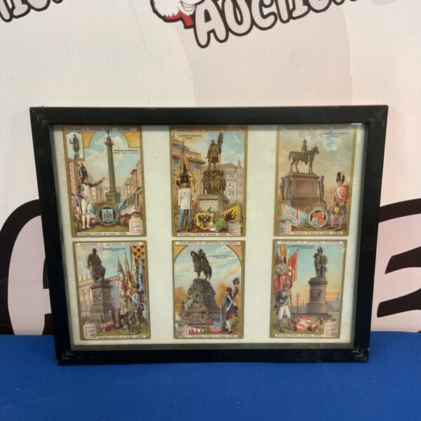 Framed vintage French monument cards, a collectible travel souvenir.