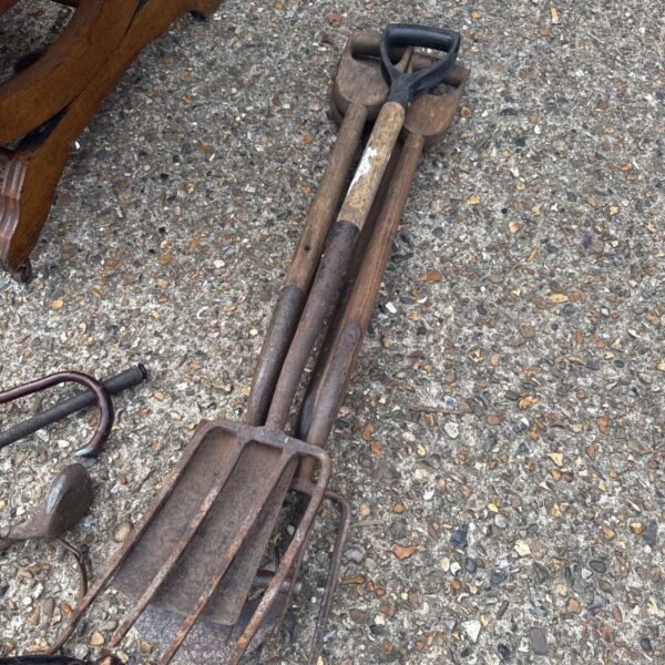 Bundle of five vintage garden tools with wooden handles.