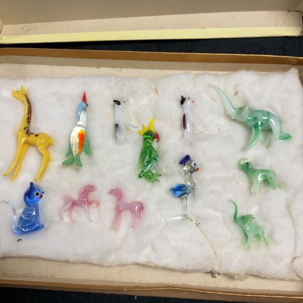 Vintage glass animal collection featuring colourful miniature figurines.