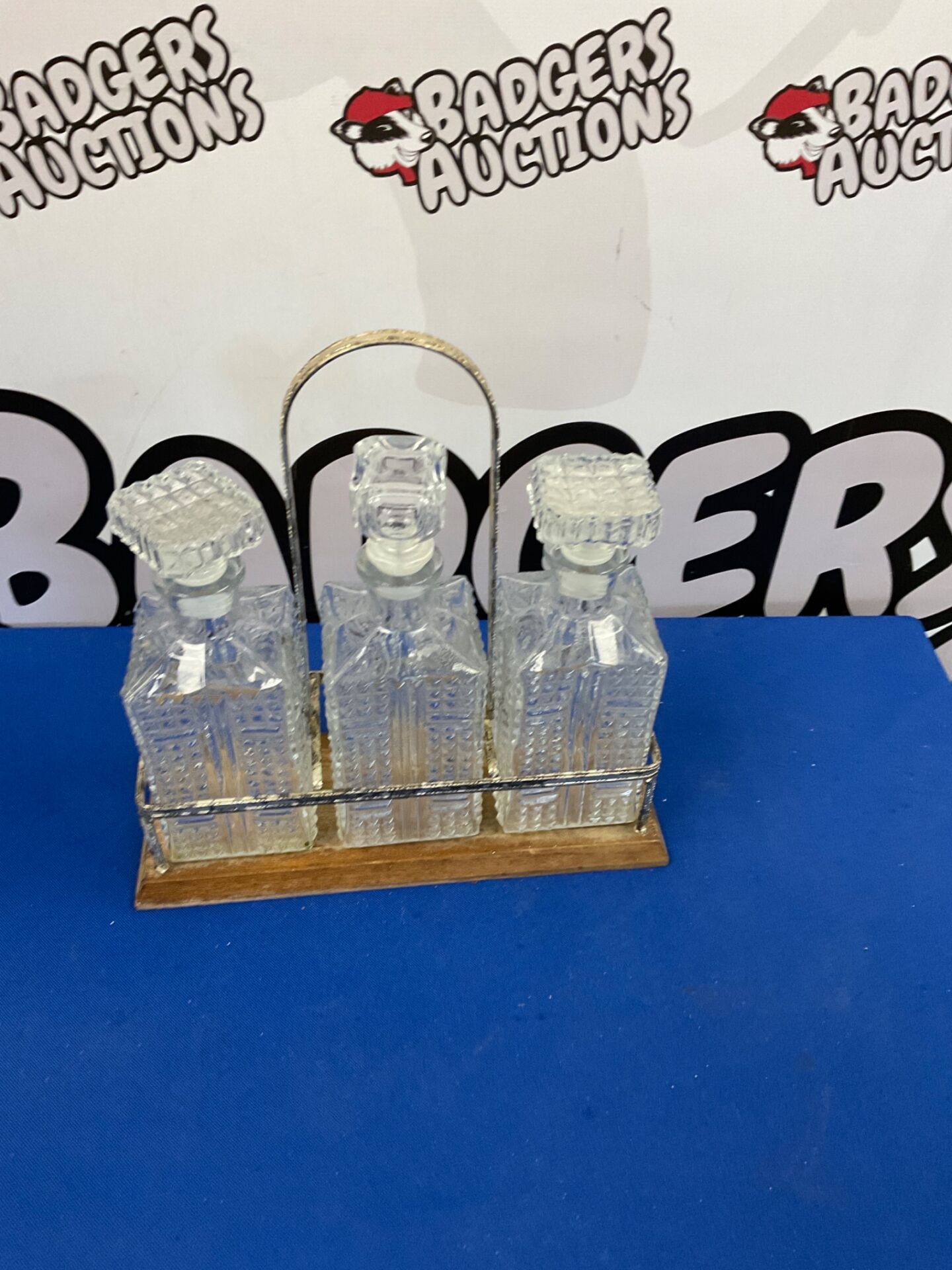 296 Three glass decanters in carry tray