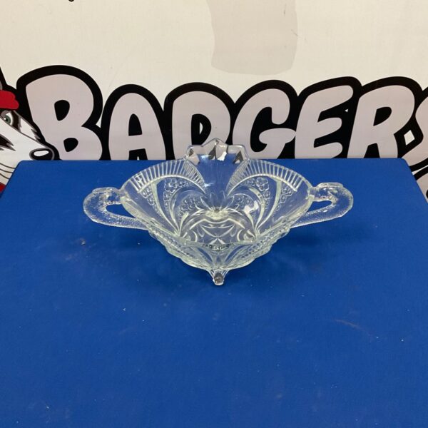 Vintage glass fruit bowl with pressed floral design.