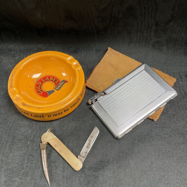 Vintage Gold Label ash tray with cigarette case and integrated lighter.
