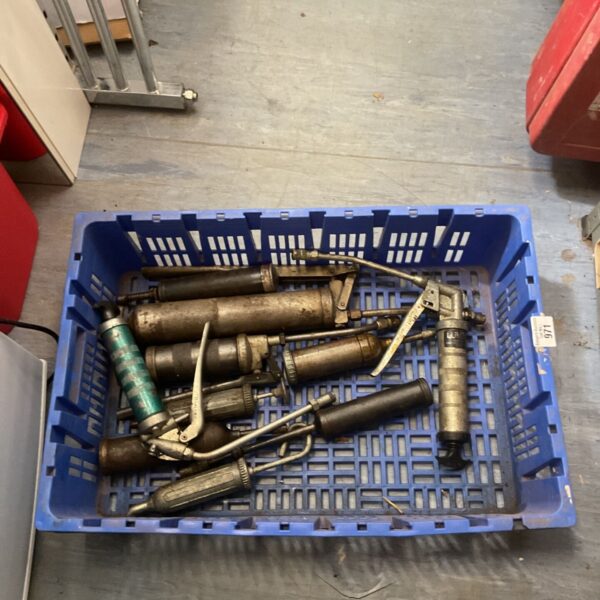 Lot of vintage manual grease guns for automotive and workshop use.