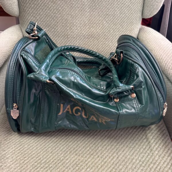 Vintage green leather Jaguar holdall, a classic retro travel bag.