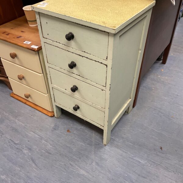 Vintage green kitchen drawers with laminate top.