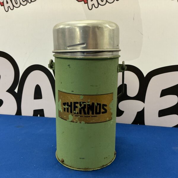 Vintage green Thermos flask, collectible mid-century design.
