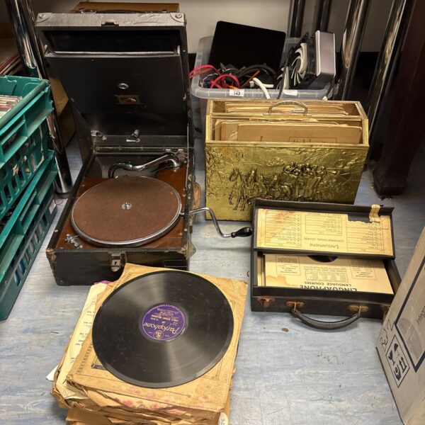Vintage HMV gramophone with accompanying vintage gramophone records.