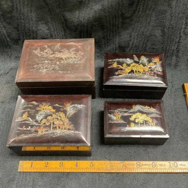 Vintage Japanese laquered boxes, a nesting set with hand-painted scenes.