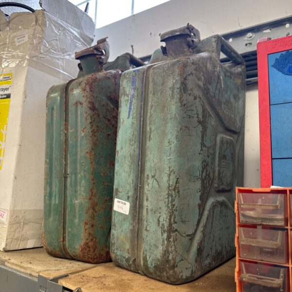 Two weathered vintage 20l metal Jerry cans.