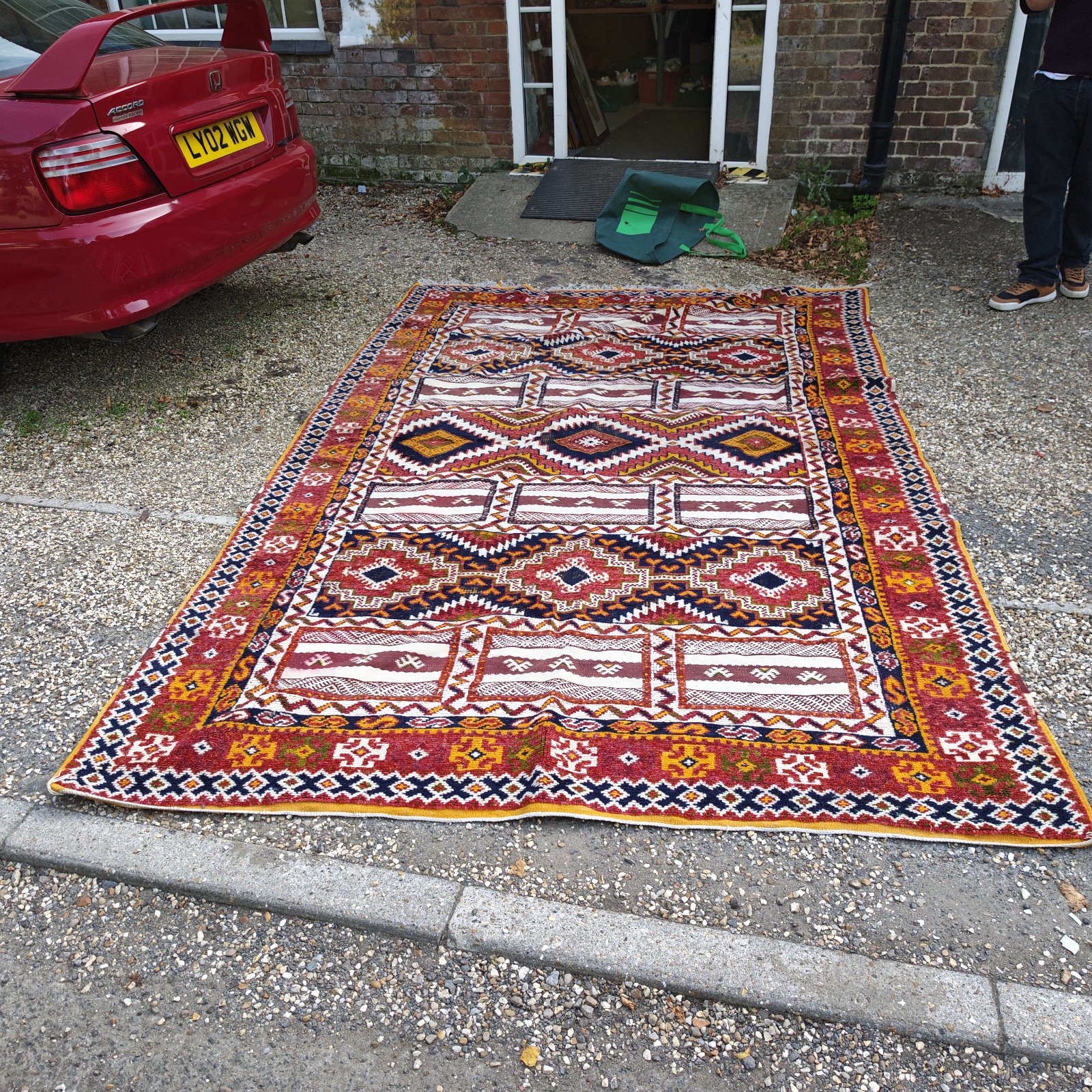 Vibrant vintage Kilim rug with geometric patterns, available in Stokenchurch.