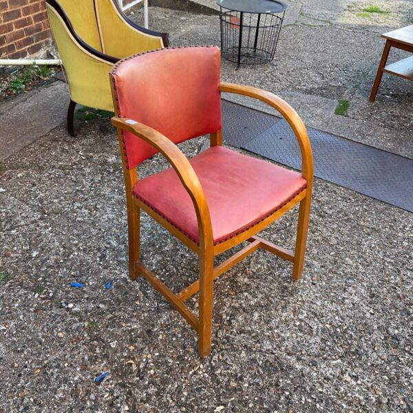Vintage leather office chair with brown upholstery and wooden legs.