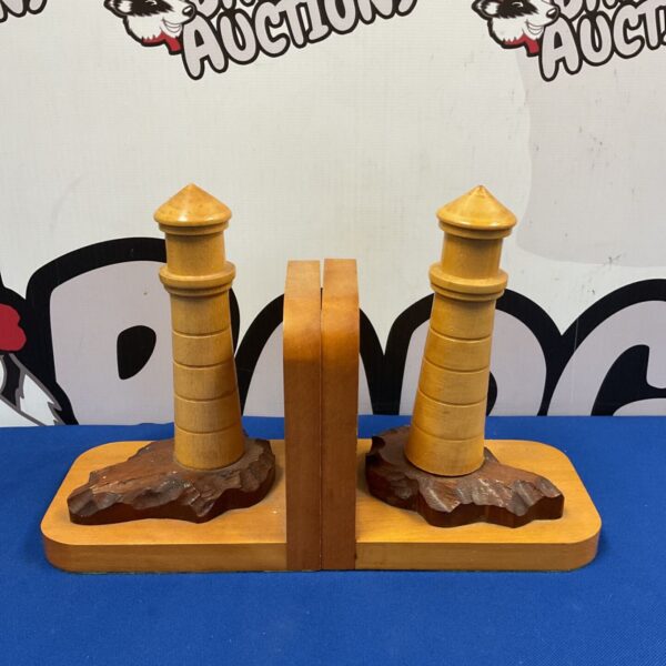 Vintage wooden lighthouse bookends for nautical home decor.