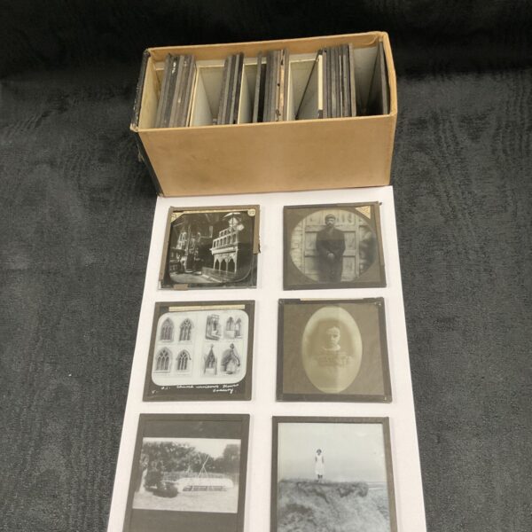 Tray of vintage magic lantern slides for collectors.