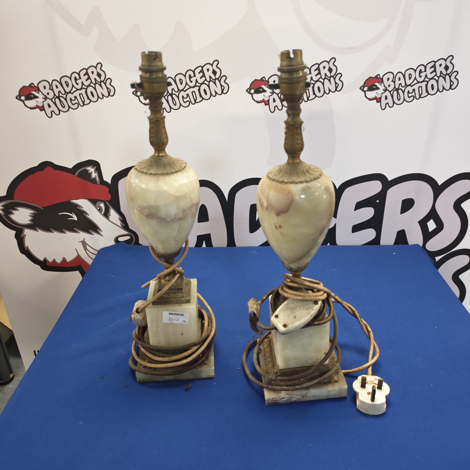 Vintage pair of marble table lamps with brass fittings.