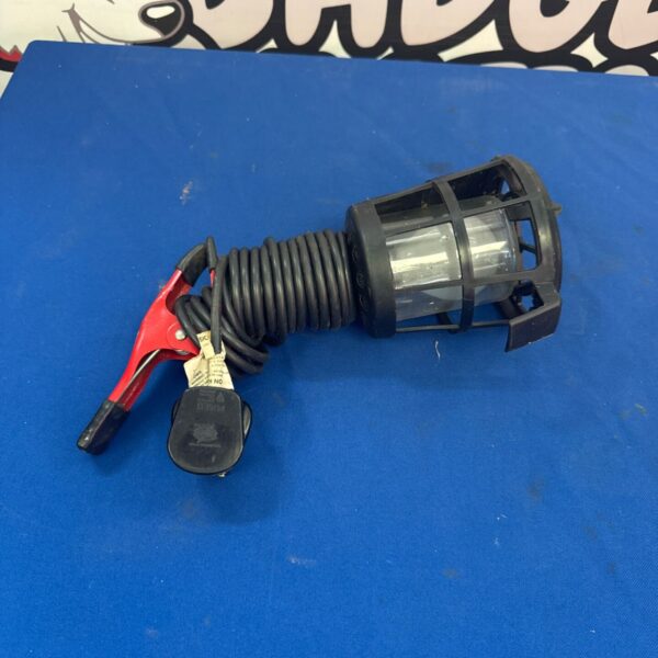 Vintage mechanics inspection lamp with flexible gooseneck and spring clip.