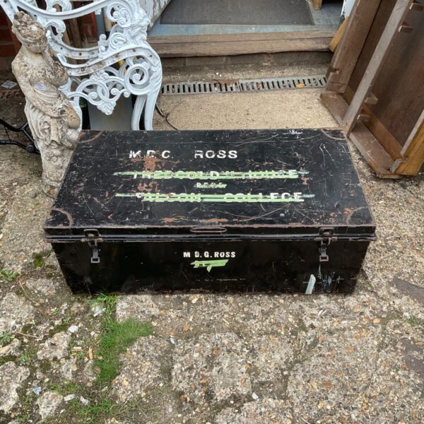 Vintage metal storage chest with a weathered patina.