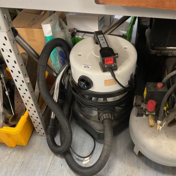 Vintage Numatic Medivac vacuum cleaner with hose attached.