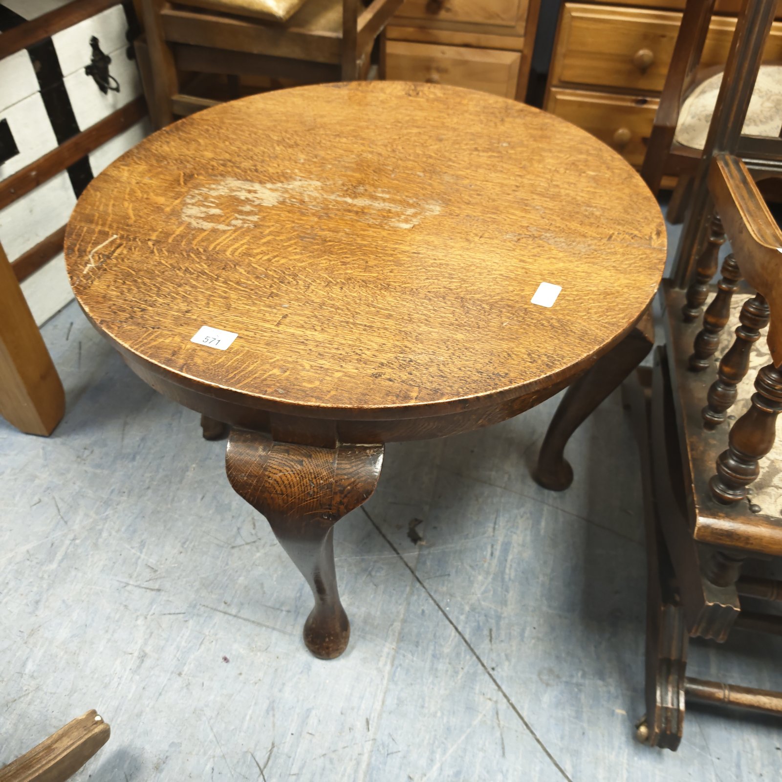 Vintage oak circular coffee table with cabriole legs.