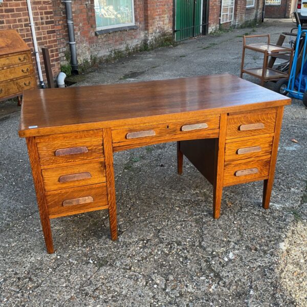 Vintage 1930s oak desk with double pedestal and central drawer.
