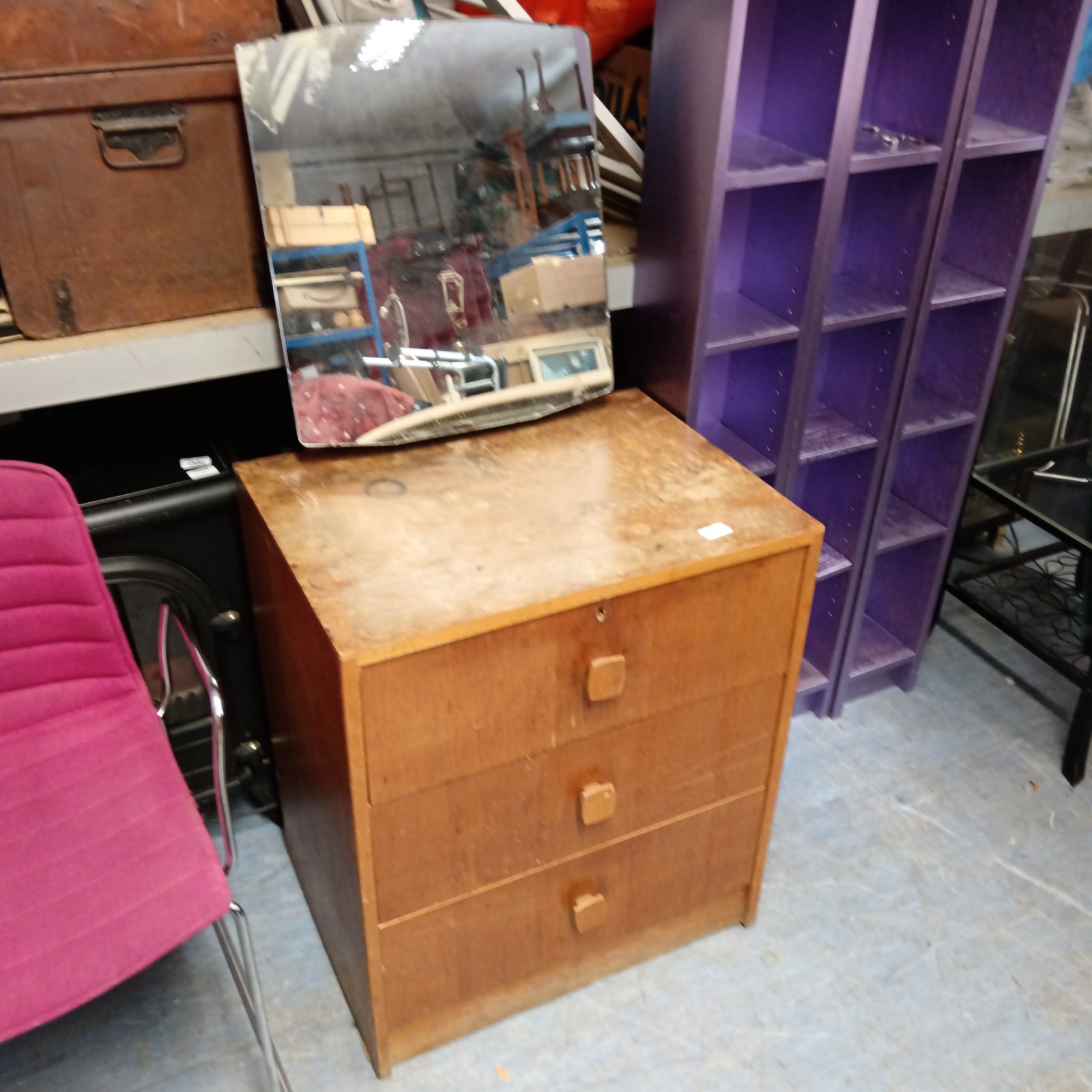 Vintage oak three-drawer dresser table with wear and tear.