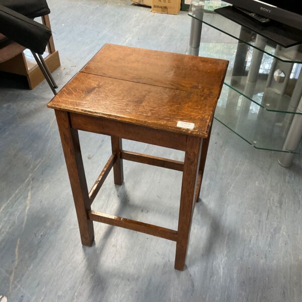 Vintage oak side table with a square top and four legs.