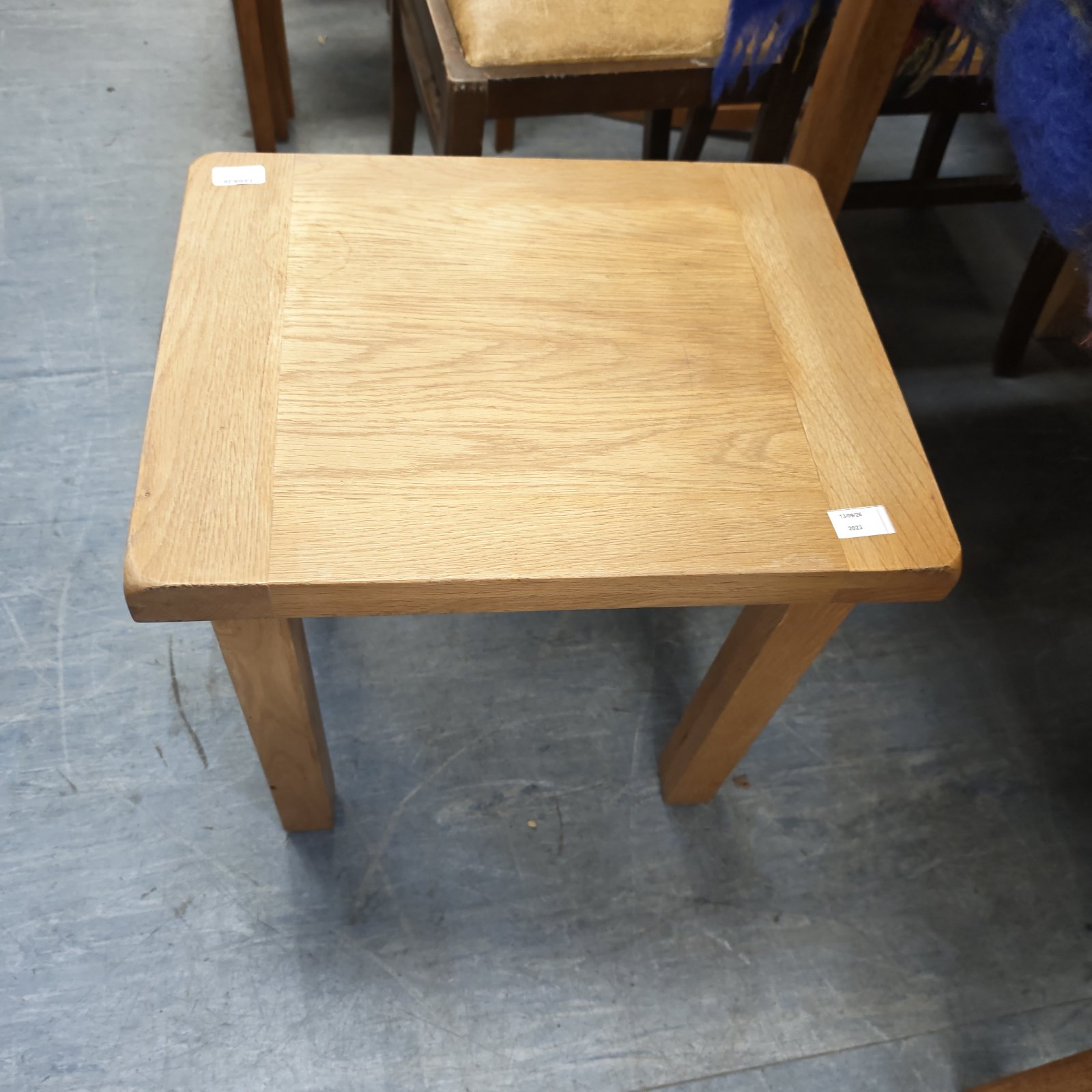 Vintage oak side table with square top and tapered legs.