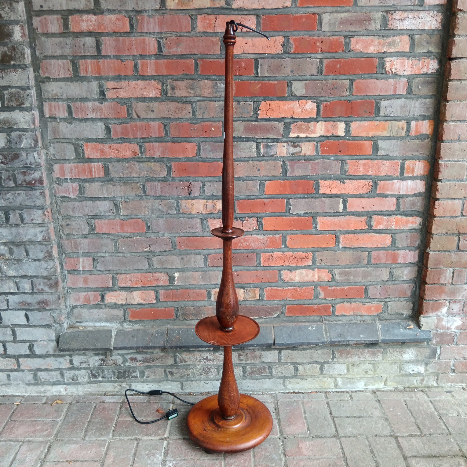 Vintage oak standard lamp with a circular shelf.