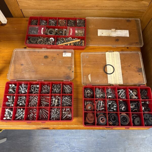 Vintage plastic organisers filled with a mixed lot of hardware and fasteners.