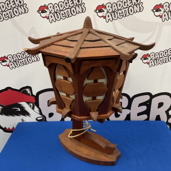 Vintage pagoda table lamp with wooden tiered design.