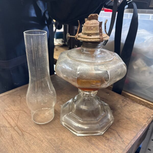 Vintage paraffin lamp with chimney, antique glass oil lighting.