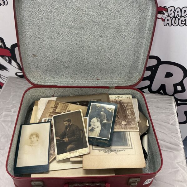Suitcase filled with a vintage photo collection, antique black and white photos.