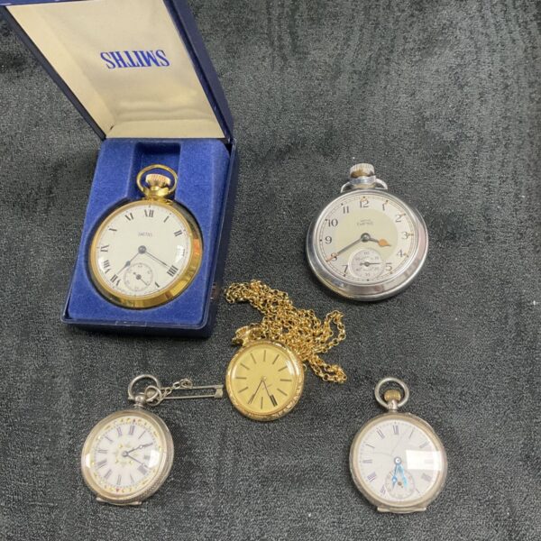 Vintage pocket watch lot including silver and Smiths examples.